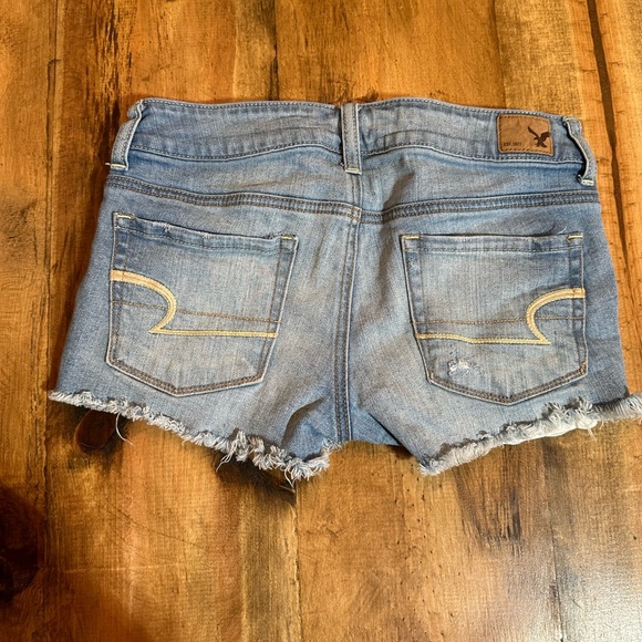 Women’s American Eagle Shortie Denim Shorts. Eyelet distressed. Size 0 - Picture 5 of 6